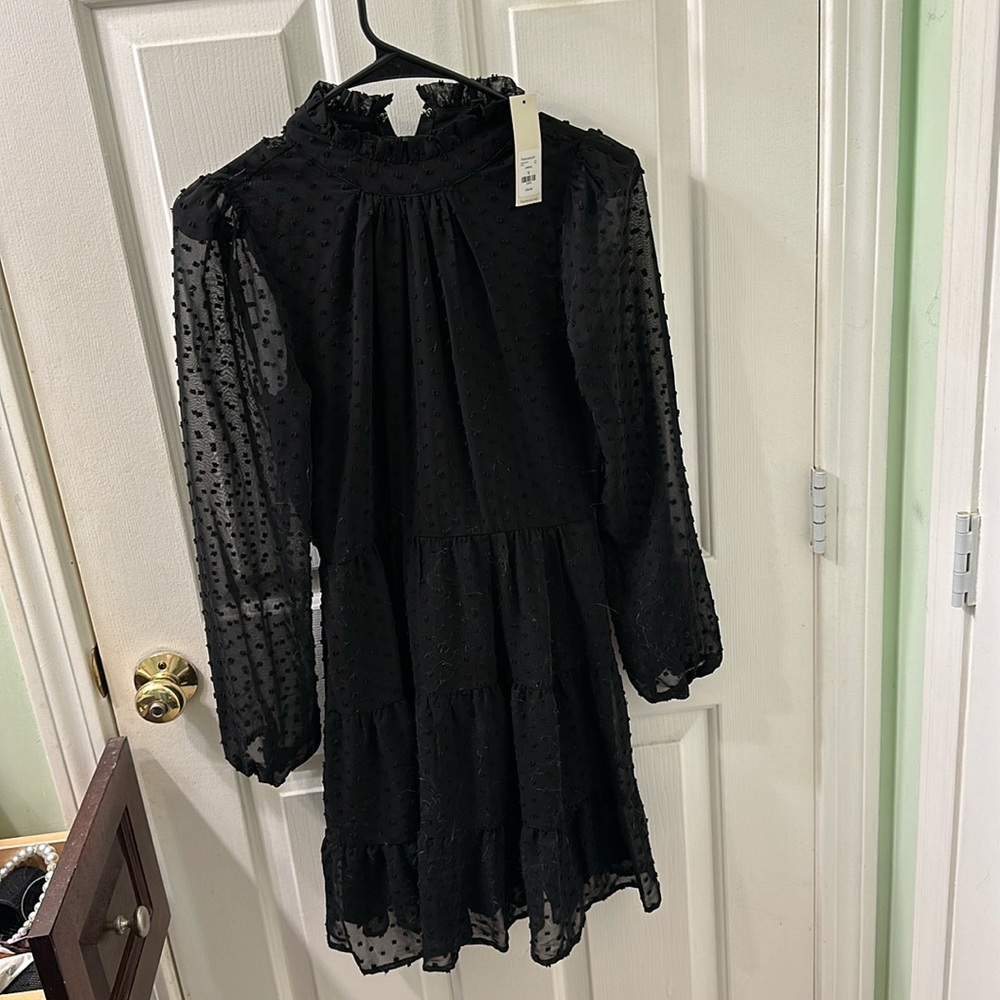 NWT textured black Francesca’s long sleeve mini dress.